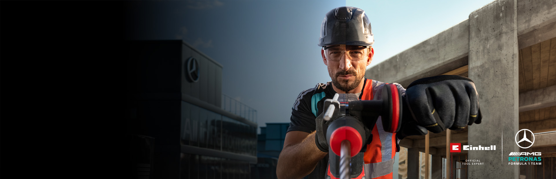 Un mécanicien en tenue de protection en train de percer à l'aide d'un outil électrique sur un chantier.